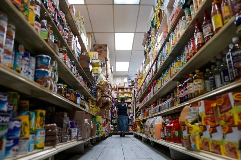 US consumer spending picks up; inflation rises moderately in July