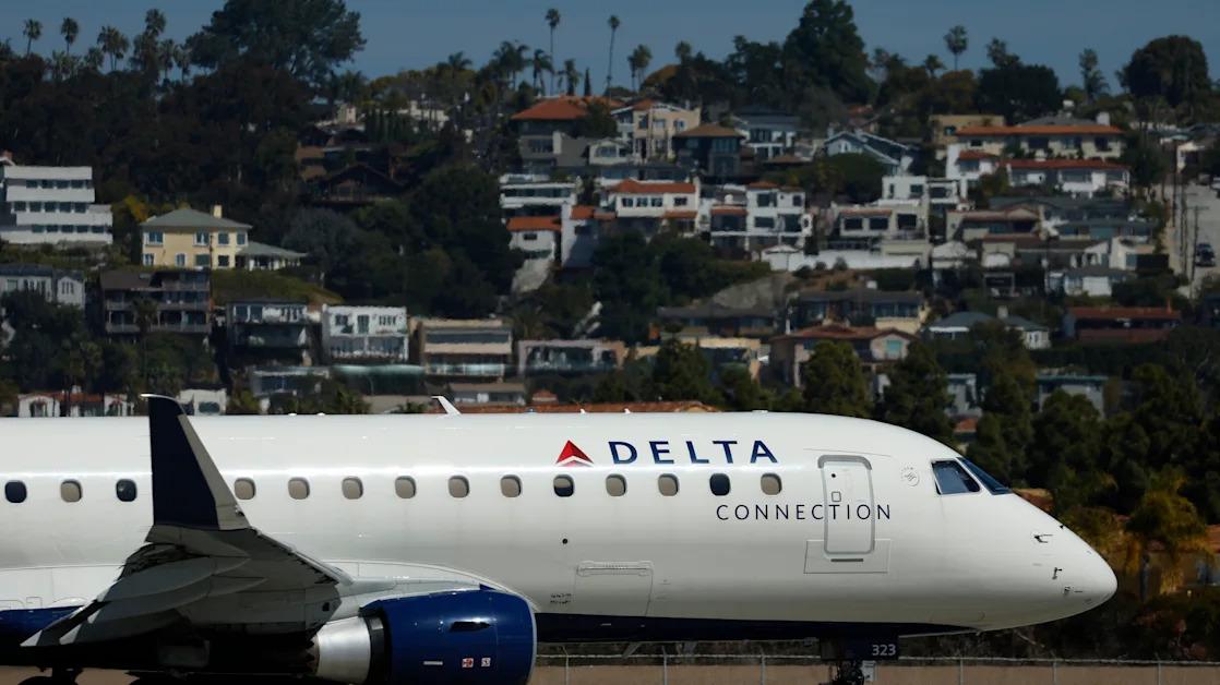 Delta stock falls after company cuts outlook, citing 'macro uncertainty'