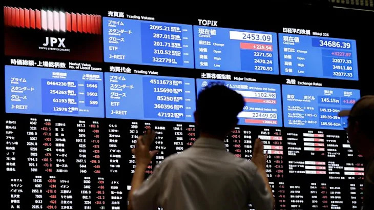 Stocks fall on Trump's auto tariffs, China bucks the trend