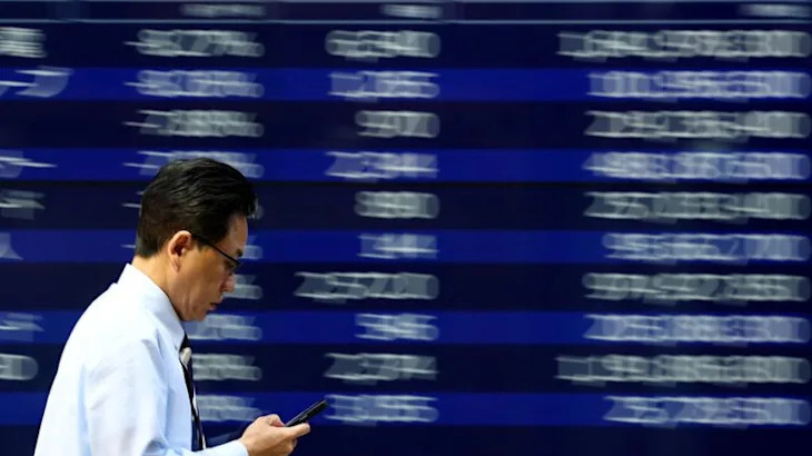 Stocks, dollar rebound as Trump backtracks on Fed attack