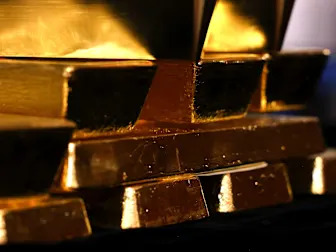 Gold edges higher after loss with US data, trade talks in focus