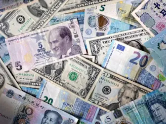 Most emerging market currencies set to hold on to gains: Reuters poll